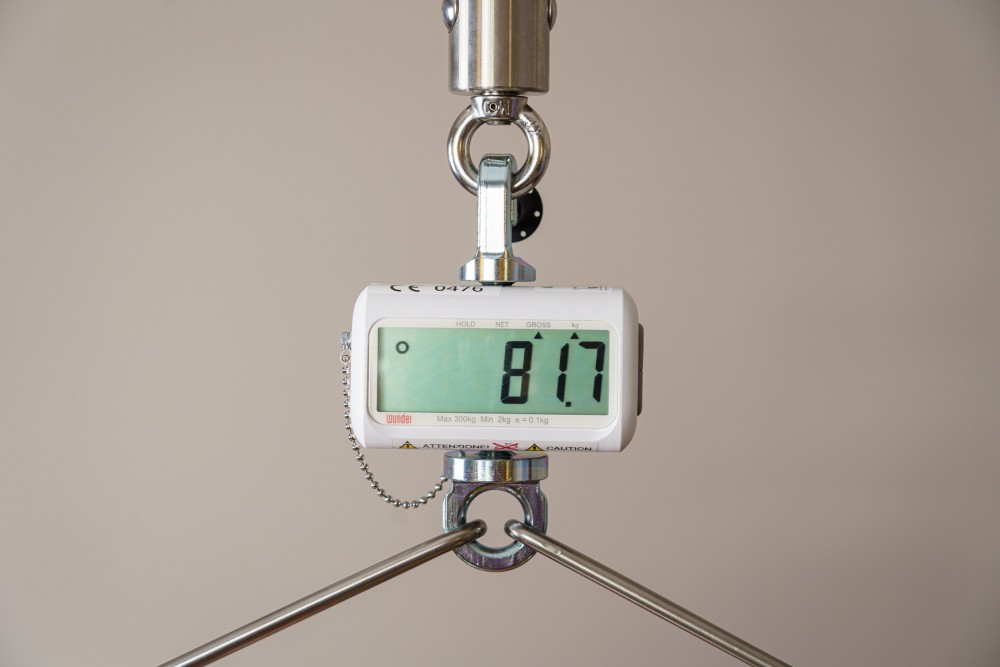 Digital scale for weighing patients placed in a sling suspended from a  ceiling lift or mobile lifter